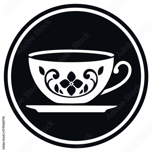 Monochrome ornate teacup icon with floral swirls and saucer inside a decorative circular border