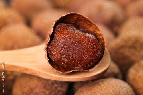 Dried Lychee Fruit from Fujian Putian China on Wooden Spoon - Traditional Asian Delicacy