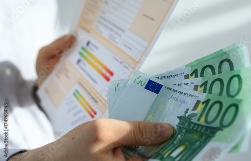 Hand holding euro banknotes...