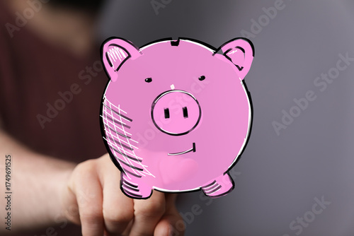 Hand holding digital piggy ...