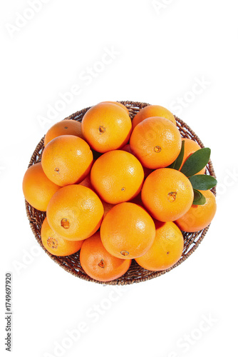 Fresh Navel Oranges in Wicker Basket with Green Leaves on White Background