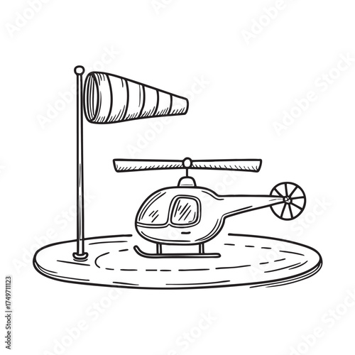 A windsock near a helicopter parked on a landing pad