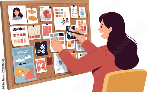 Woman working on a mood board with pictures and color swatches