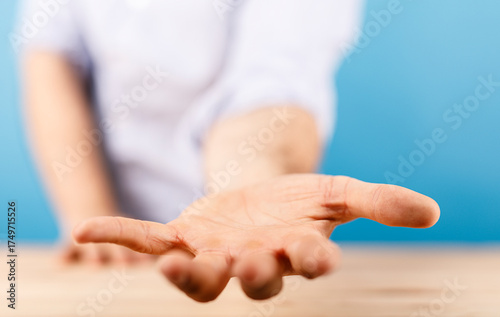 A person's hand extended in...