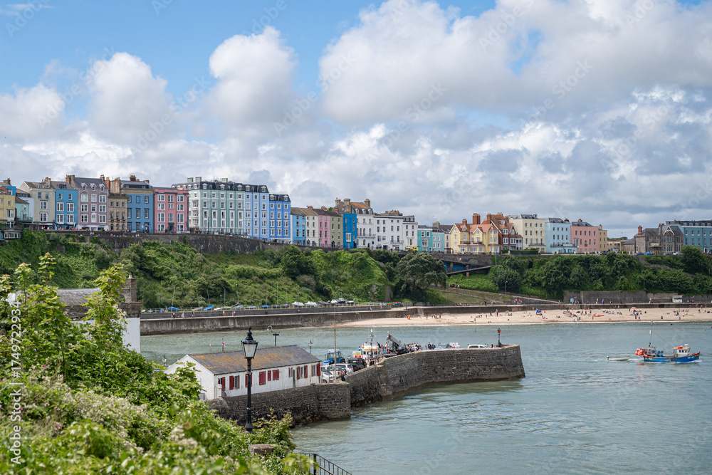 Fototapeta premium View of North Beach, Tenby, Pembrokeshire, Wales, UK, with the famous, colourful buildings overlooking the beach