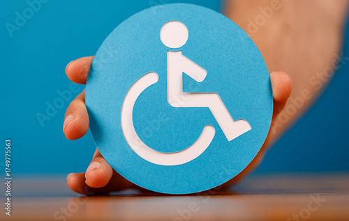 A person holds a wheelchair...