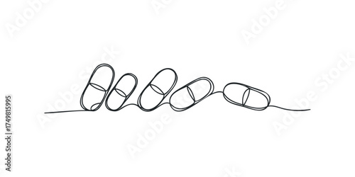 Line drawing of four medical capsules on white background