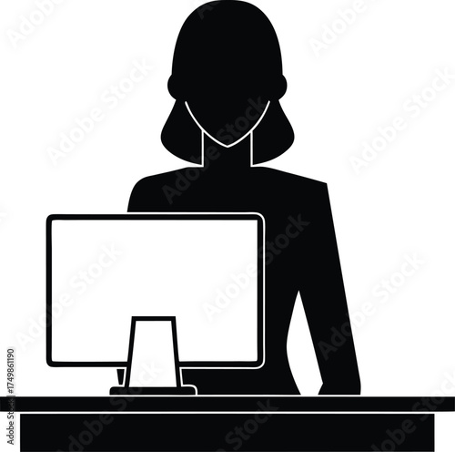 Female professional working diligently on a desktop computer at her office workstation