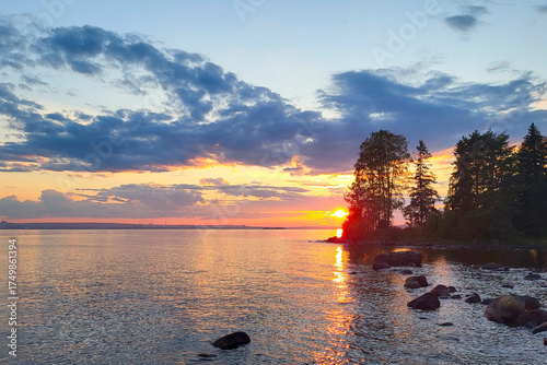 Bild auf Leinwand Evening sunset in September over the large Lake Onega in Karelia.