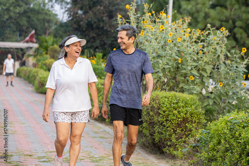 Valokuva Active Indian senior couple jogging outdoors staying healthy and happy