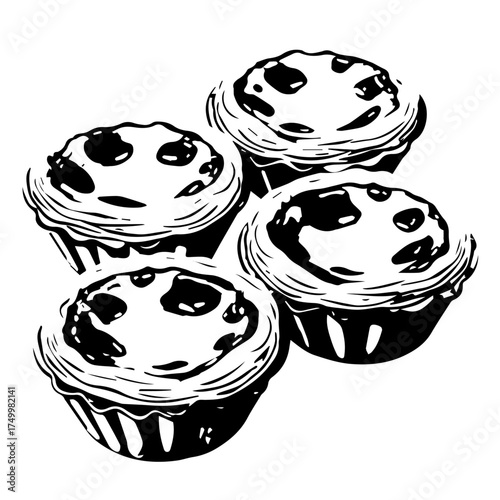 Four Delicious Portuguese Egg Tarts with Flaky Crusts and Darkened Tops.