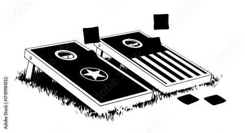 Two Black Cornhole Boards with Star and Stripe Designs on Grassy Surface.