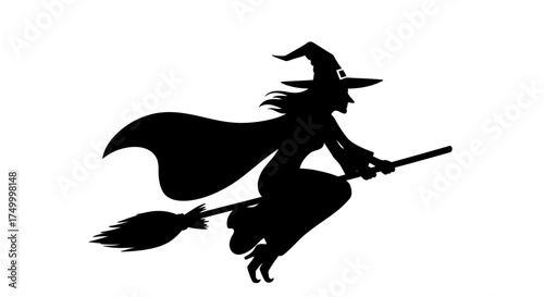 Silhouette of a witch flying on a broomstick with flowing cape and hat perfect for halloween themed designs and celebrations isolated on white background