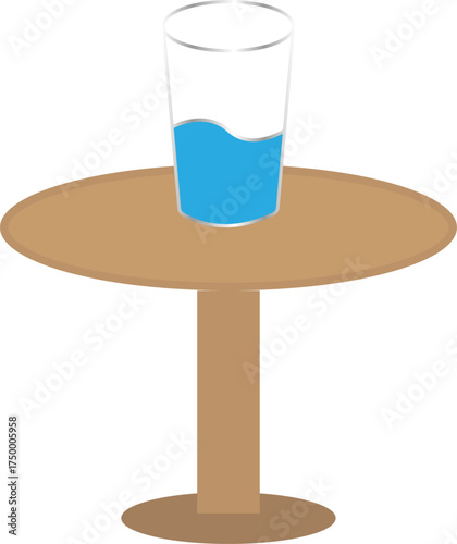 Glass of blue liquid on a round wooden table