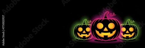 Glowing neon halloween pumpkins with smiling faces on black background