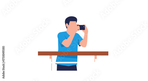 Man taking a photo with his smartphone holding it horizontally wearing a blue shirt.