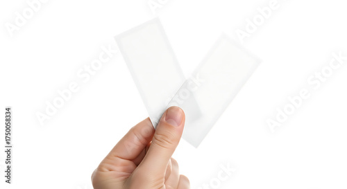 Hand holding two blank white rectangular paper or plastic strips isolated on transparent background
