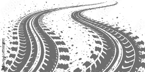 The path of travel is marked by the line of tire tracks curving across the asphalt road and sand