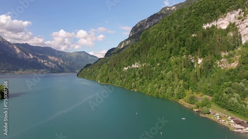 The beautiful Interlaken valley and Thunersee lake, Beatiful river at Switzerland in sunny day during summer, Aereal drone view of stunning idyllic nature scenery of lake Brienz with turquoise waters