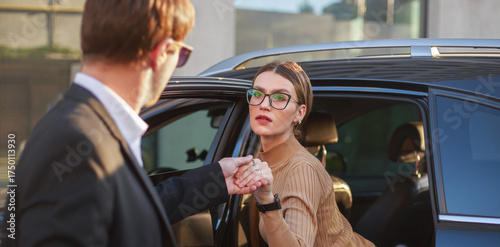 Corporate meeting of two employees in car for work and discussion of business