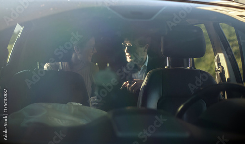 Corporate meeting of two employees in car for work and discussion of business