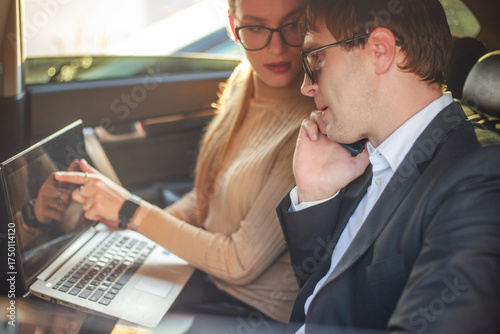 Corporate meeting of two employees in car for work and discussion of business