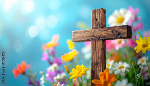 Wooden cross in sharp focus with blurred colorful spring flowers in background, Easter and religious