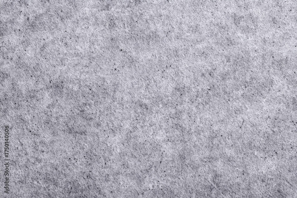 Obraz premium Gray textured paper background with subtle fine grain pattern