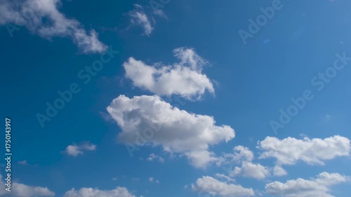 Timelapse of Moving Clouds in Blue Sky. Clouds Drift Through Bright Blue Sky – Timelapse Video. Fast Motion Clouds Floating Across Clear Blue Sky.