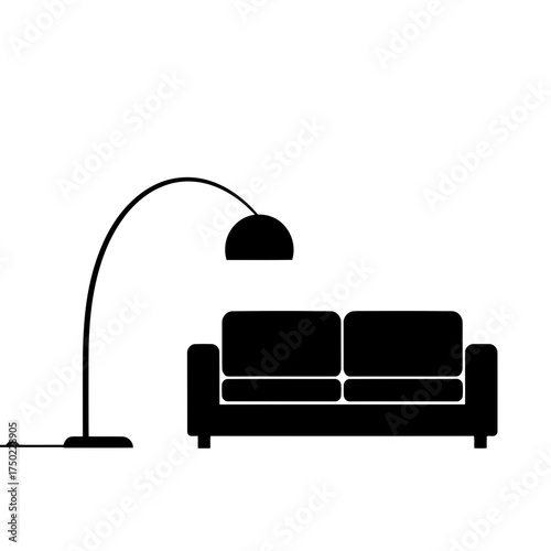 Modern black arc floor lamp illuminating a minimalist twoseater sofa
