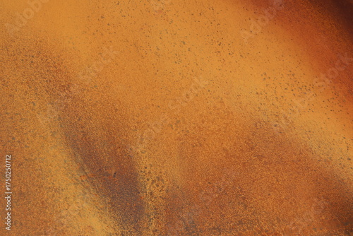 Rusty metal background in brown, red and orange colors. Rusty métal with particles and texture. Grainy rust and construction industry. Canvas and pattern in metallic texture.