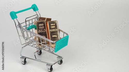 Gold bars in a small shopping cart symbolizing wealth, investment, and financial growth on a clean white background.