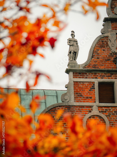 Majestic Renaissance Rosenborg Castle, home of the Danish Crown Jewels, set against the vibrant autumn foliage of the King's Garden in Copenhagen, Denmark.