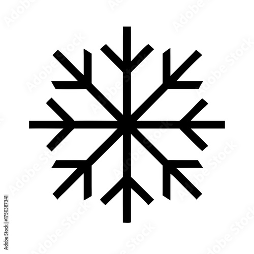 A close up of a black cat with bright green eyes looking directly at the camera with a curious and intense gaze in a dark setting