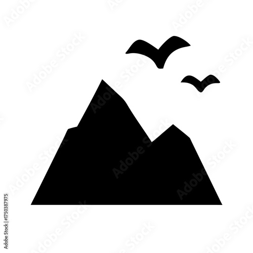 A close up of a black cat with bright green eyes looking directly at the camera with a soft focus background of greenery and bokeh lights