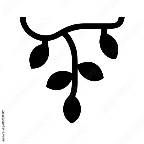 A close up of a black cat with bright green eyes looking directly at the camera in a studio setting with a plain black background and soft lighting