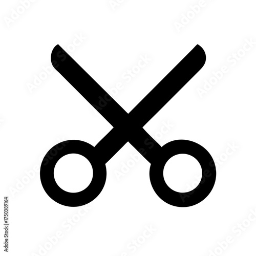 A close up of a black cat with bright green eyes looking directly at the camera with a soft focus background of green leaves and foliage