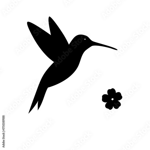 A close up shot of a black cat with bright green eyes looking directly at the camera with a serious expression in a dimly lit room