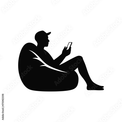 Black silhouette person wearing cap using smartphone while relaxing on beanbag white