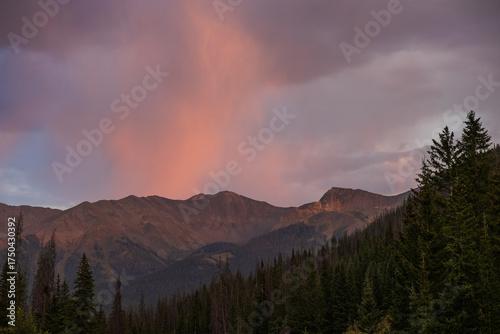 sunset rain over distant mountains
