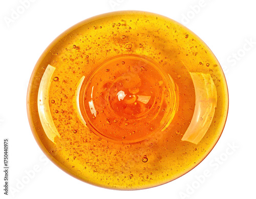 Circular, golden-amber liquid with a raised, central portion, swirling texture