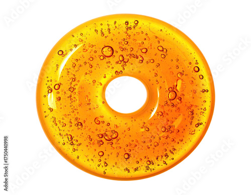Close-up of a translucent golden ring shape with bubbles, against a black background