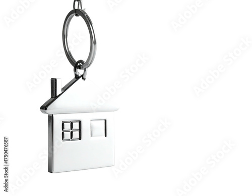 Silver house-shaped keychain suspended against a black background