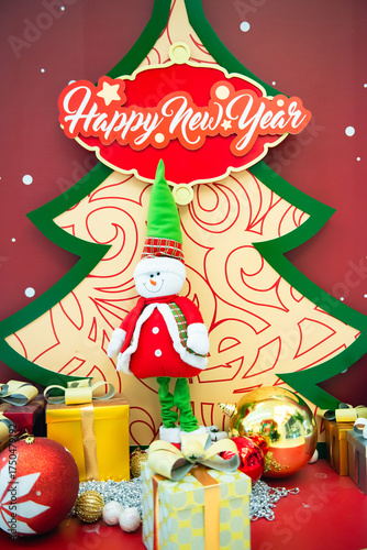 Christmas tree, gift box, ball and snowman display during the Christmas season for a photography.