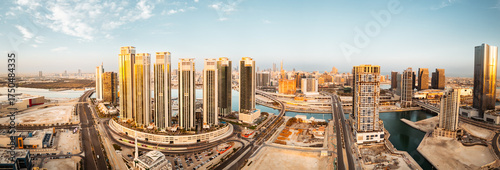 Abu Dhabi, UAE - 25th april, 2025: Abu Dhabi capital city UAE skyline with real estate buildings sunrise panorama with clear blue sky. Business real estate marina heights copy space banner