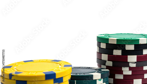 Close-up view of poker chips stacked in various colors on a black background