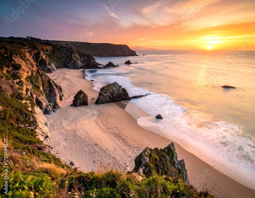 Coastal scene at sunset with beach and rock formations