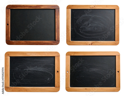 Four vintage chalkboards, some clean, some with chalk marks, with wooden frames