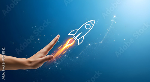 Hand reaching towards a rocket launching upwards, symbolizing growth and future success