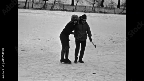 Vintage film, Happy young couple hugging on snowy winter outdoor. Youth boy in love, embracing smiling girl with joy. Romance love, affection. Old happiness archive video. Archival retro 1960s